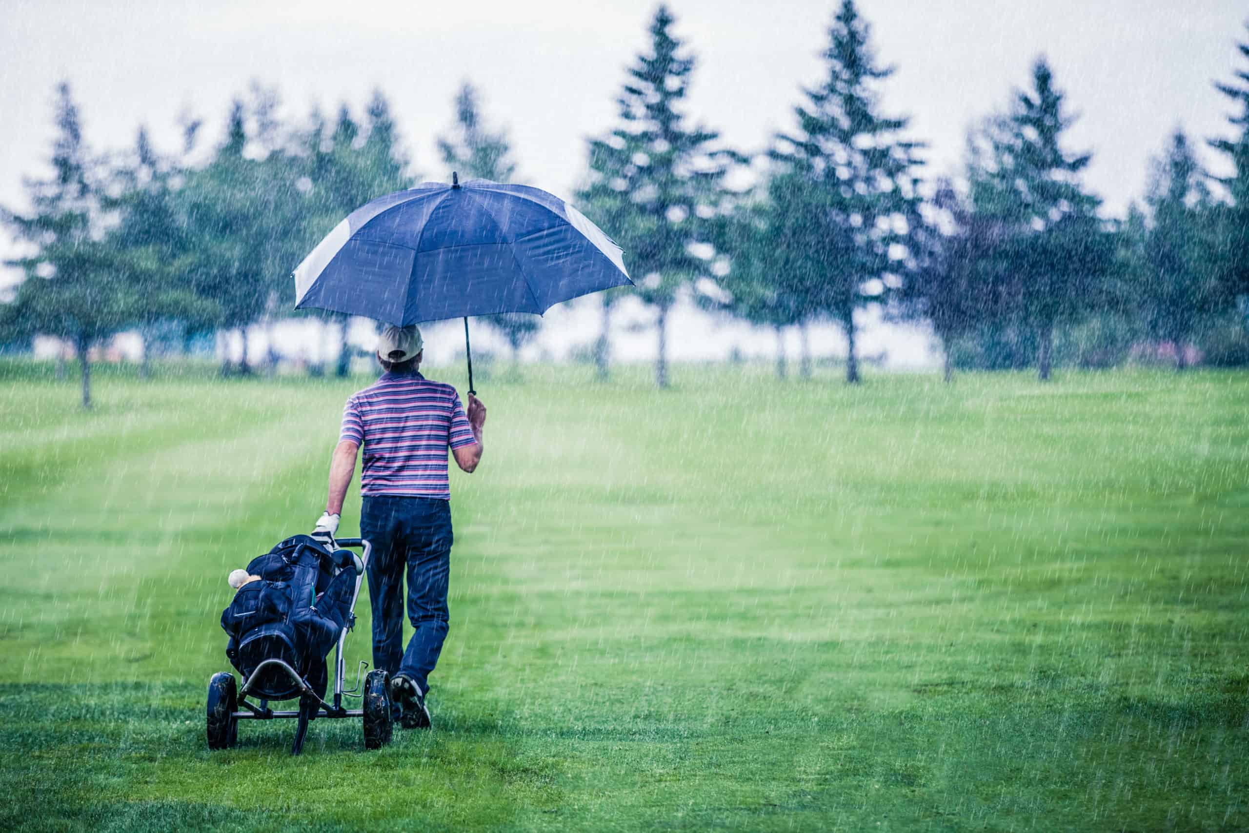 Golfer on a Rainy Day Leaving the Golf Course – Golf Journey 365